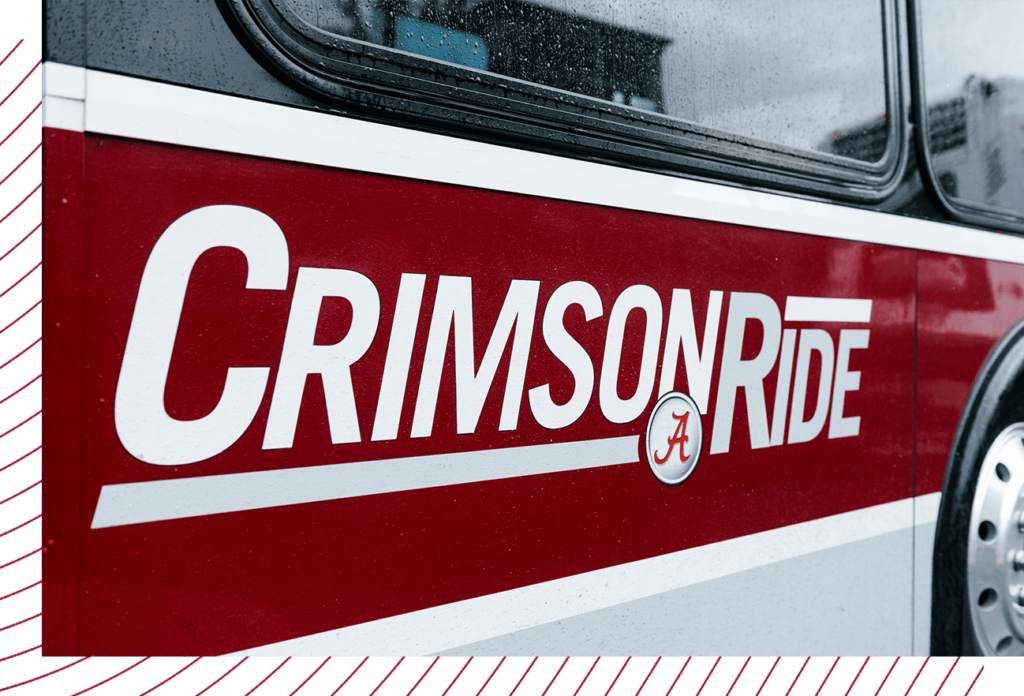 Up close photo of the CrimsonRide logo on a bus.