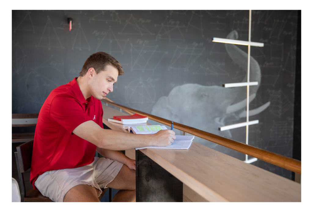 A student studies at a coffee shop